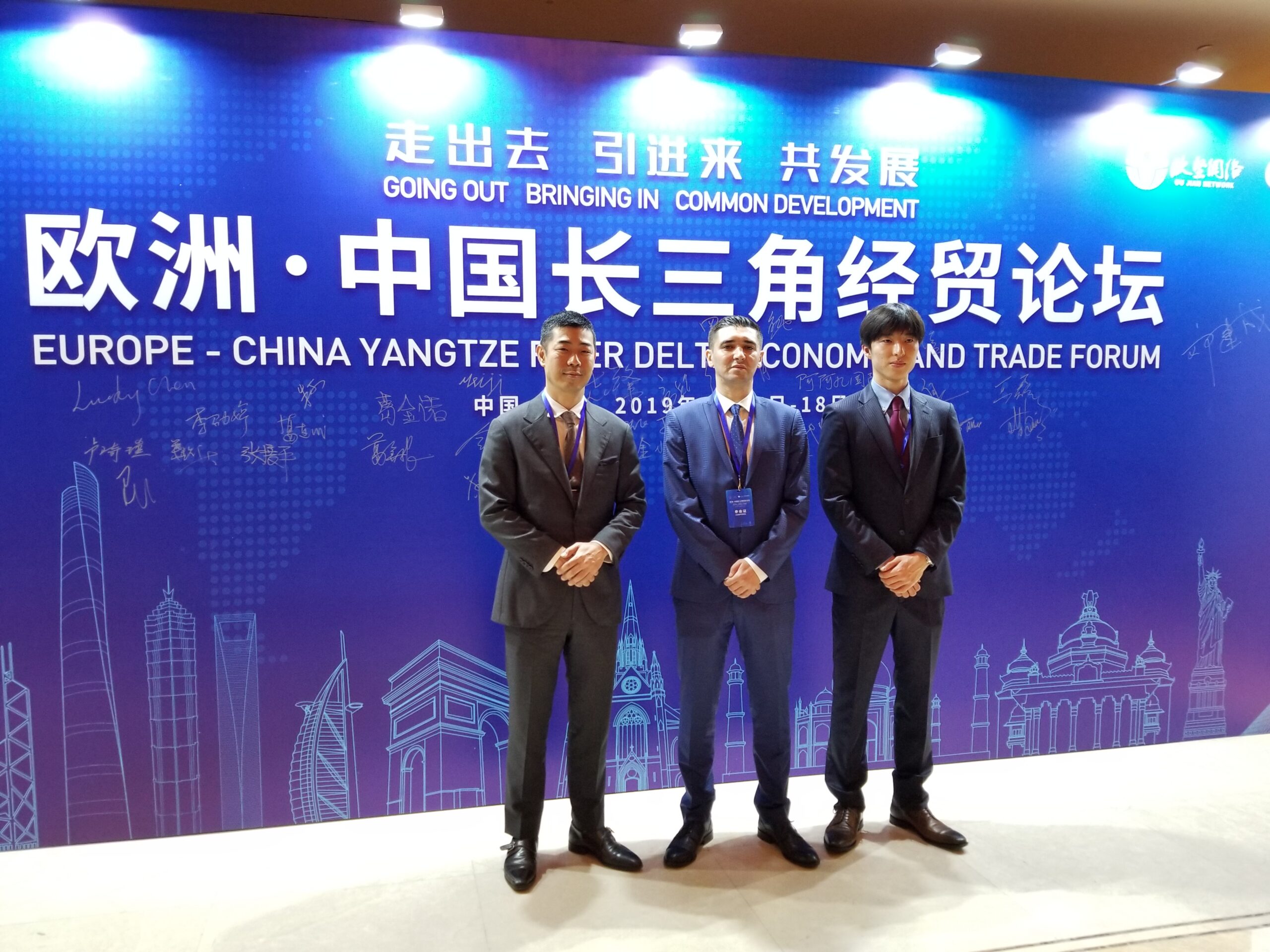 Suleyman alongside businessmen at an event in Shanghai